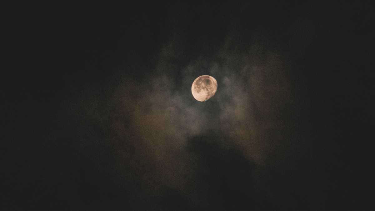 moon in a cloudy night sky