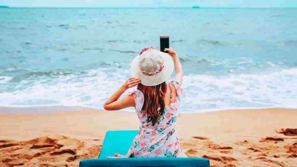 woman taking a selfie at the beach